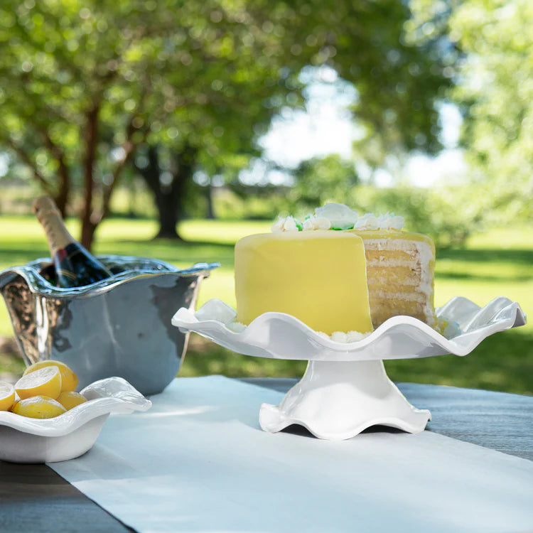 The Vida Havana white melamine pedestal cake plate  by Beatriz Ball shown with a lemon cake
